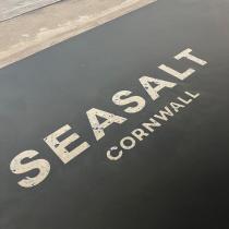Microcement floor with Seasalt logo